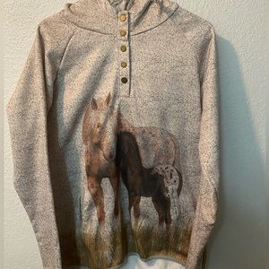 A hoodie with horse on it super warm inside cream with black little dots on it